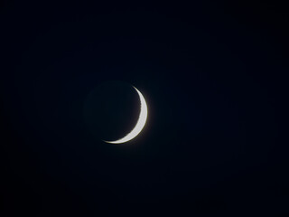 New month in the middle of the night sky