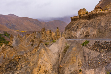 Obraz premium View from hilly mountain road Hindustan Tibet road travelling through pinnacles are geological landform of steep columns of rocks left by ice weathering & erosion in sedimentary rocks.
