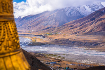 Landscape of braided Spiti river valley and snow capped mountains during sunrise from Key or Kee...
