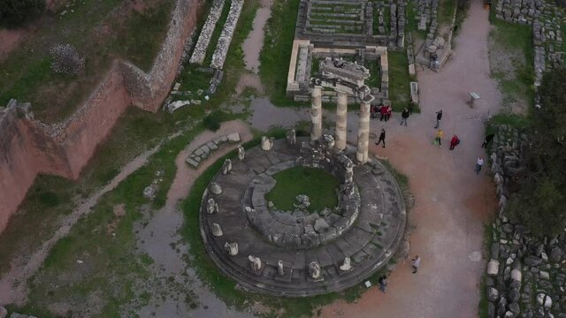 Drone video of iconic Temple of Athena Pronaia in archaeological site of Delphi, Voiotia, Greece