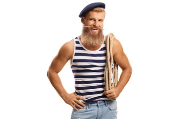 Bearded smiling sailor holding a rope on his shoulder
