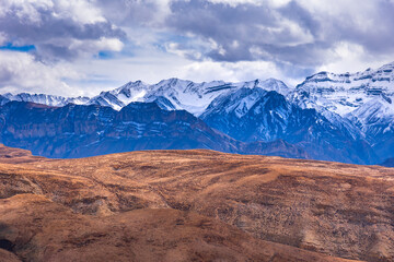 Naklejka na ściany i meble Panoramic Landscape of Spiti valley with snow capped mountains in background near Hikkim and Langza village of Kaza town in Lahaul and Spiti district of Himachal Pradesh, India.