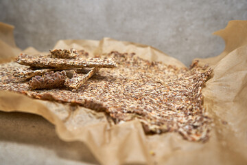 Divided flax seed crackers on the dried not yet divided tortilla. 