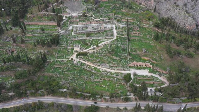 Drone video of iconic Temple of Athena Pronaia in archaeological site of Delphi, Voiotia, Greece