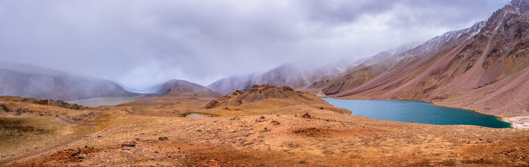 Panoramic view of Chandratal or Lake of the moon is a high altitude lake located in Himalayas of Spiti Valley, Himachal Pradesh, India. The name of Lake originated due to its crescent moon like shape.