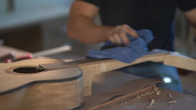 craft man making guitar on wood table, capenter working concept