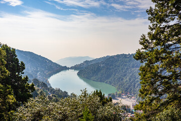 Fototapeta na wymiar Nainital Lake is a natural freshwater body formed by tectonics. It is a popular tourist destination to enjoy vacations among tourist who visits most popular hill station Nainital in Kumaon region.