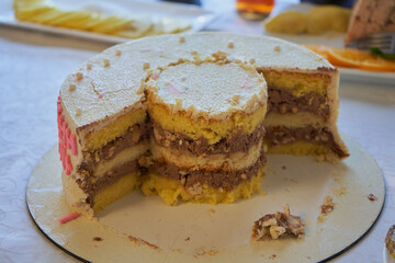 cake cut on the table,half of the cut cake on the table