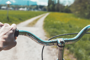 Retro bicycle handlebar and breaks outdoors, blurred background
