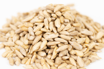Peeled Sunflower seeds isolated on white background. Shallow depth of field