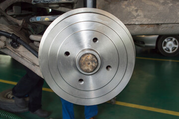 New brake drum on the rear axle of the car