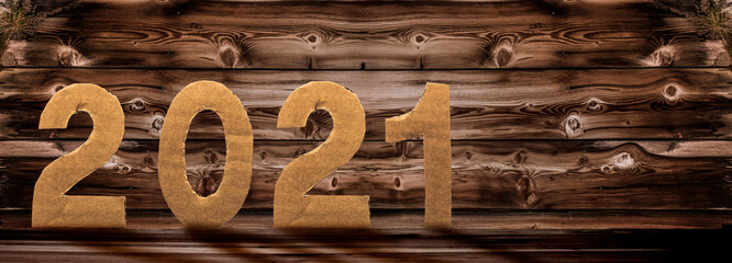 Unscharfer Holz-Silvesterhintergrund mit 2021 Schrift
