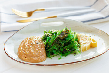Chuka seaweed salad with nut sauce on plate