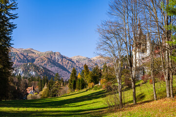 Peles and Pelisor Castle with Romanian Carpathian Mountains in the background