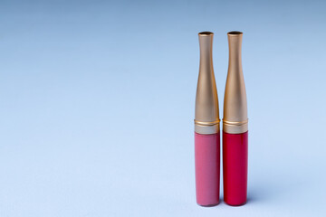 Lip make up product on pink background