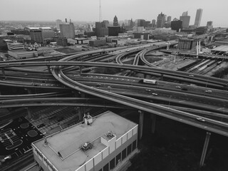 aerial view of freeway interchange with traffic and view of the city