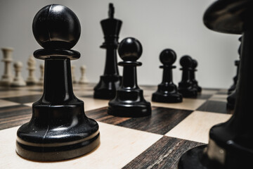 Chess figures on chess board macro photo