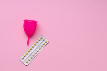 Menstrual cup and oral contraceptive pills top view