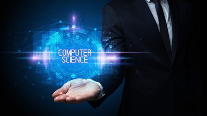 Man hand holding COMPUTER SCIENCE inscription, technology concept