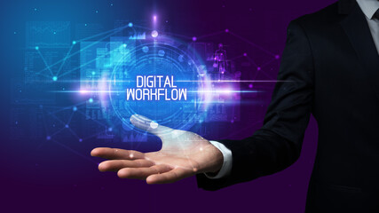 Man hand holding DIGITAL WORKFLOW inscription, technology concept