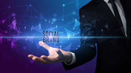 Elegant hand holding SOCIAL BRAND inscription, social networking concept