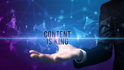 Elegant hand holding CONTENT IS KING inscription, social networking concept