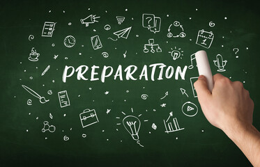 Hand drawing PREPARATION inscription with white chalk on blackboard, education concept