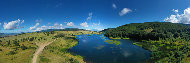 default 180 degree virtual reality panorama of Biviere lake immersed in the beautiful beech forest of Monte Soro in spring on the Nebrodi, Sicily, Italy. Natural lake with views of Mount Etna and sea.