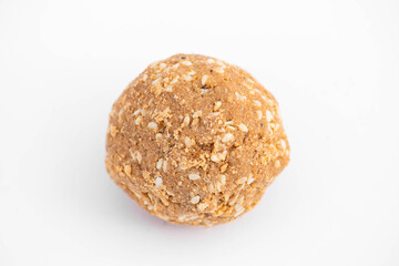 Single Til Gul Laddu Made Of Hammered Sesame Seeds Peanuts And Assorted Dry Fruits Isolated On White Background With Blank Space For Text. Consumed In Winters On Makar Sankranti And Lohri Celebration
