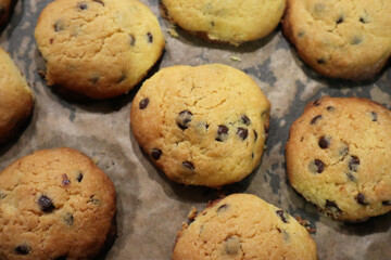 Homemade Tasty cookies with chocolate chips on baking tray for newyear 
