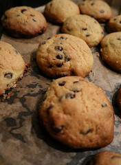 Homemade new year cookies with chocolate chips on baking tray
