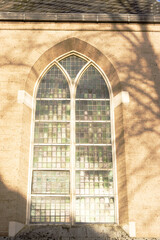 Closeup of the facade with large windows of a monumental church in Deventer, Netherlands