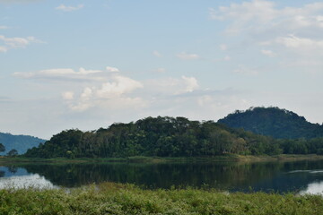 landscape of water reservoir lake with mountain background