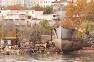 Fototapeta na wymiar Cutting ships for scrap. The skeleton of a ship on the coast of Sevastopol.
