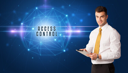 Businessman thinking about security solutions with ACCESS CONTROL inscription