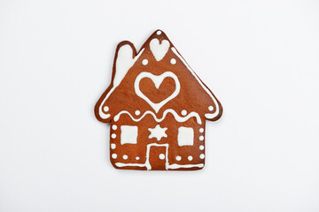 The hand-made eatable gingerbread house on white background - 401839412