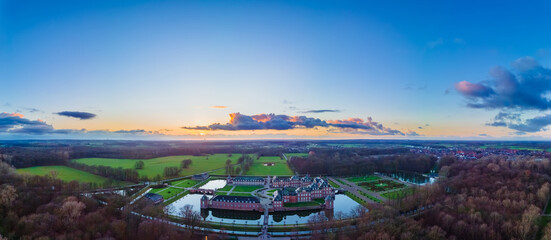 Ancient castle on the water, beautiful sunset, sun, clouds, landscape, autumn.