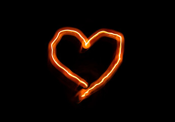 bright flame burn heart symbol on black background in the dark, Valentine's day or romantic concept background, copy space, space for text