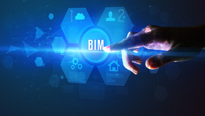 Hand touching BIM inscription, new technology concept