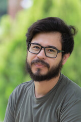 Fototapeta premium portrait of a mexican man with beard and glasses 