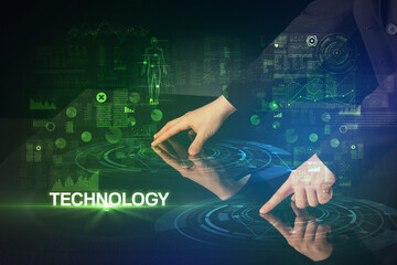 Businessman touching huge display with TECHNOLOGY inscription, modern technology concept