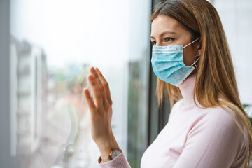 Woman with mask to protect her from coronavirus. Quarantine, isolation, stay at home concept.