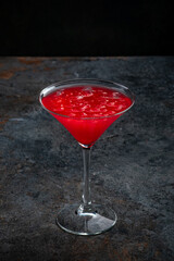 Classic cosmopolitan Cocktail on a dark stone background for the bar menu