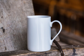 Obraz na płótnie Canvas White porcelain coffee cup, mug on old wooden table
