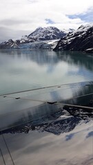 Glacier Bay, Alaska US: View from the top deck of the cruise ship on the Margerie Glacier with a reflection on the glass surface