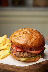 Set of burgers with french fries and ketchup sauce.