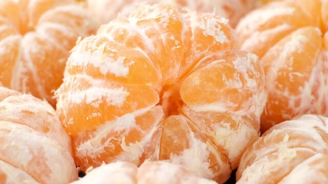 peeled tangerines close up rotation