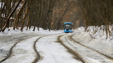 Blue tram in the Sokolniki winter park in Moscow