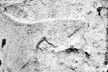 Texture of a concrete wall with cracks and scratches which can be used as a background