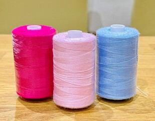 Reels of different coloured cotton thread for sewing. No people.